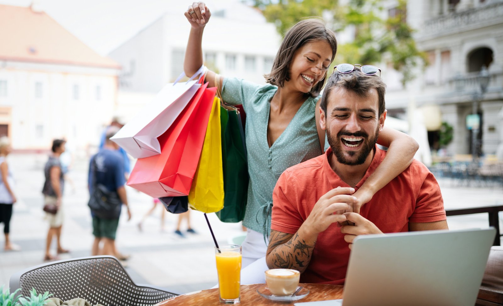 Loving couple having fun at a restaurant. Shopping, date, work, happy people concept.